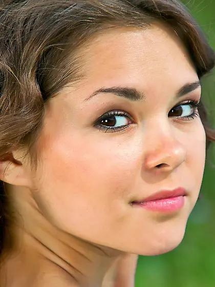 Adorable brunette Nastya K is posing naked in the garden like a