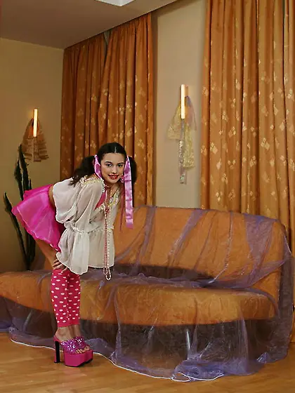 Cute pigtailed teen Felicity Fey takes off her pink skirt and sh