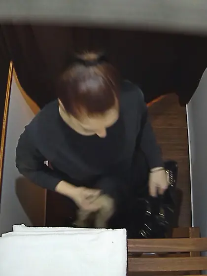 Elegant brunette undresses black