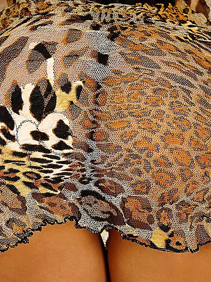 Sexy girl Lara Stevens shows trimmed pussy through sheer panty a