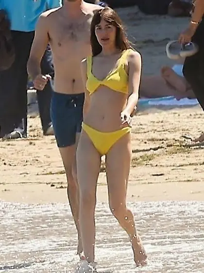 Dakota Johnson in a yellow bikini