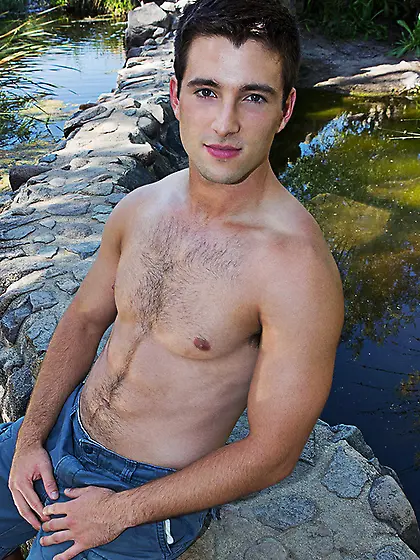 Seductive brunette gay lad posing on camera...