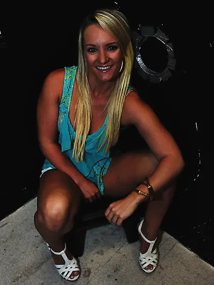 Luscious teenage blonde with a pink bra displays her cute round