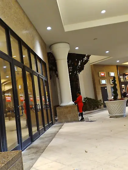 Red dress juicy GILF with phat ass at the casino.