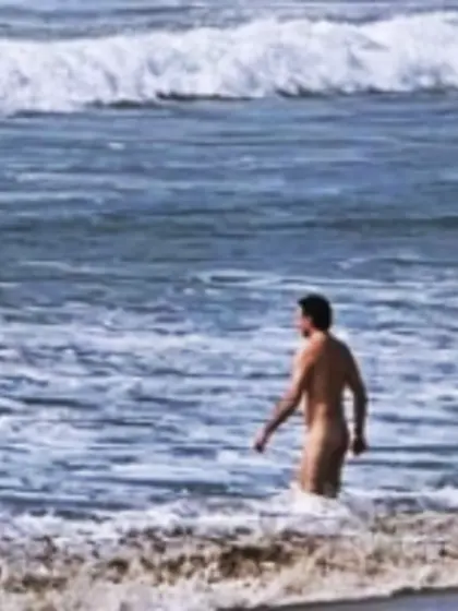 Man skinny dipping at the beach/pool