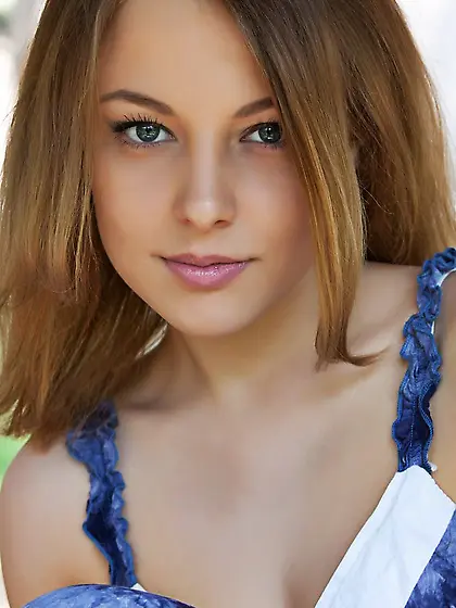 The beauty teen Nikia A is outdoor posing topless and showing th