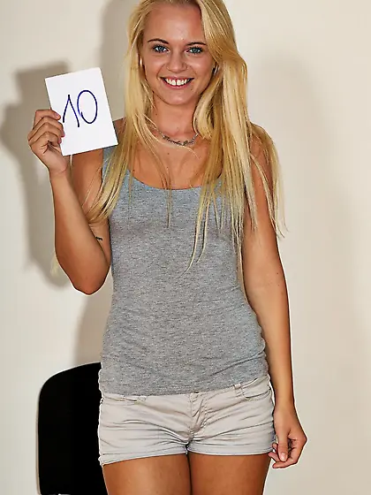 Passionate and alluring blonde Vanda Lust poses naked on the cha