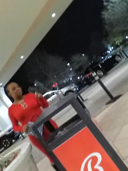 Red dress juicy GILF with phat ass at the casino.