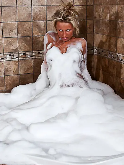 Hot blonde chick Kendra Rain gets nude in the jacuzzi and teases