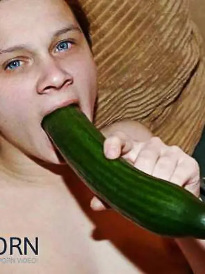 Super-Bitch plays with a cucumber