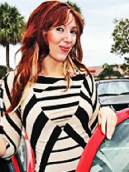 Tattooed ginger milf sucking