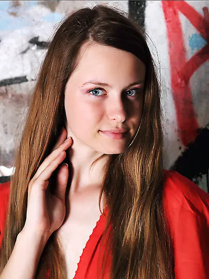 The beautiful shaved pussy of young Milana K participates in the