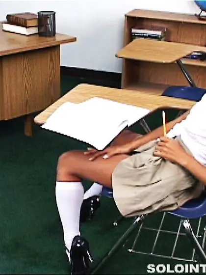 Asian schoolgirl Arcadia Davida in beige skirt strokes her pussy