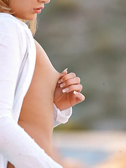 Twisted blonde with tiny titties flaunting it while outdoors