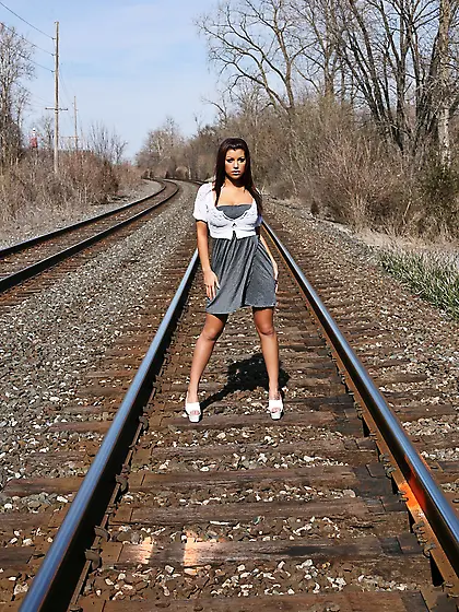 Horny teen chick Briana Lee Online strips on the rail road and s