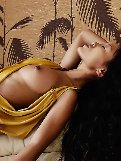 Mariko A removes her sexy yellow dress on the sofa and shows her