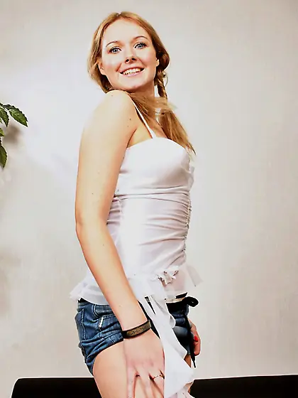 Pretty girl with beautiful smile Marnie stretched all over couch