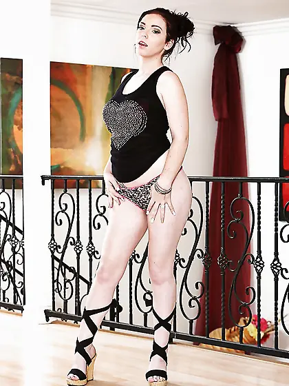 Tempting brunette girl undresses to expose big natural titties a