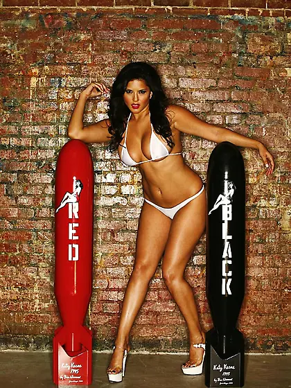 Sunny Leone takes her white lingerie before the camera and shows