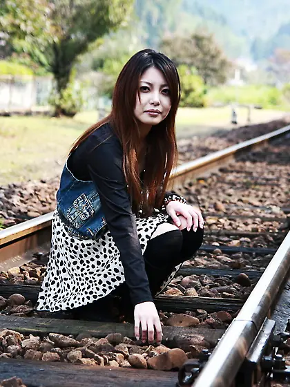 Good-looking oriental lassie walks alone and slowly gets naked o