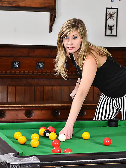 Kinky young lady is playing billiards and demonstrating her sens