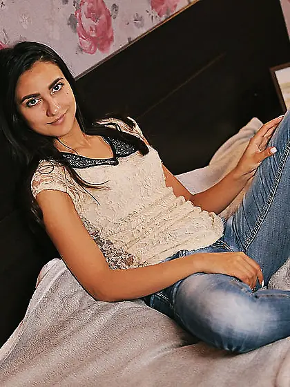 Skinny teen with sexy feet undresses and relaxes touching pussy