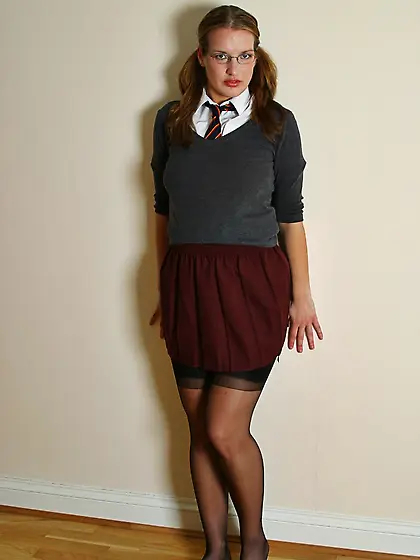 Four-eyed school chick Kat flashes her sexy tits and pussy while