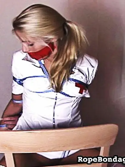 Beautiful bound nurse in stockings showing...