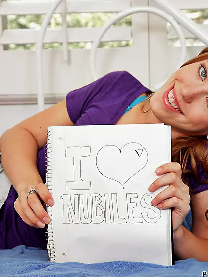 Redhead Pepper Kester spreads her long legs and fills her pink l