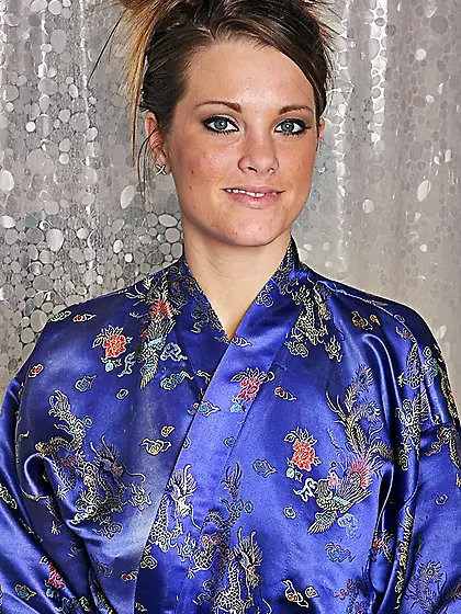 Big breasted brunette Megan Fenox removes her black panties and