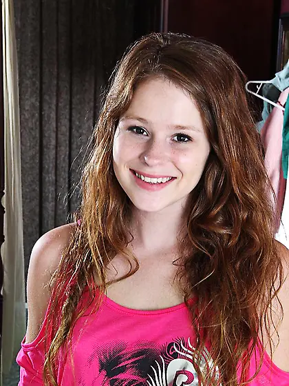 Cute and tiny brunette teen Alice Rae slips out of her clothes a