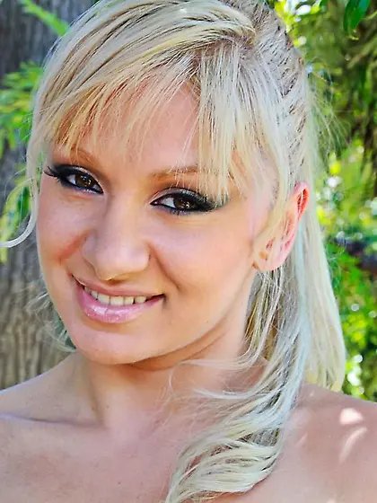 Cuddly blonde Lea Lexus pinches her tits and shows off her ass i