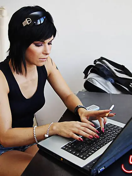Edgy raven-haired hottie smoking