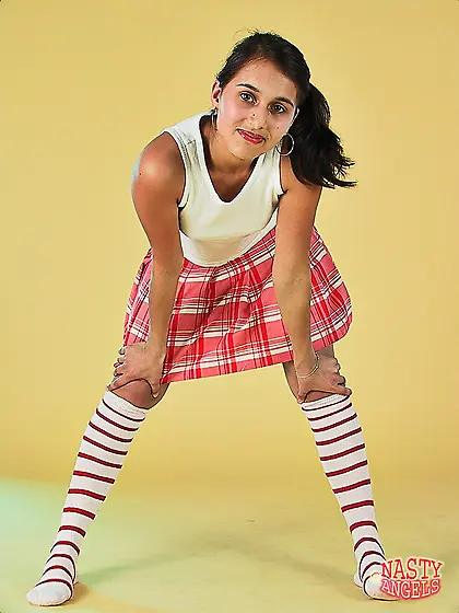 Teen strips down leaving only striped high socks on her sexy ski