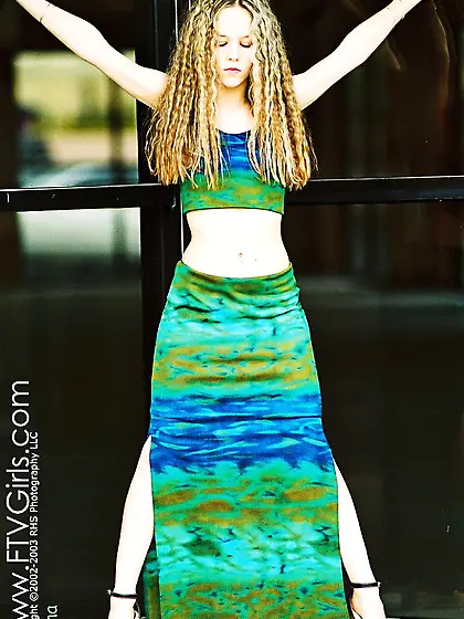 Pantyless curly haired babe Fiona Luv lifts her long dress up to