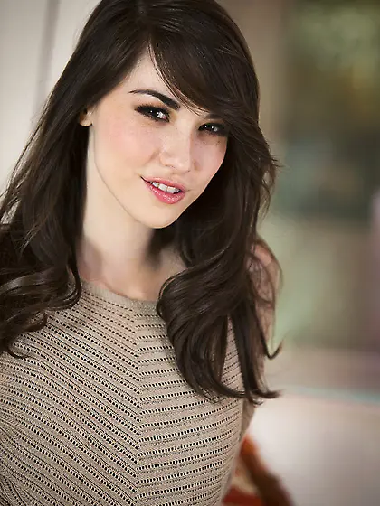 Dark-haired bombshell riding her lover's massive cock on ca