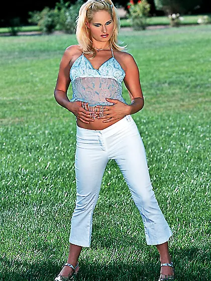 Attractive blonde vixen Gabrielle strips outdoors and exposes he