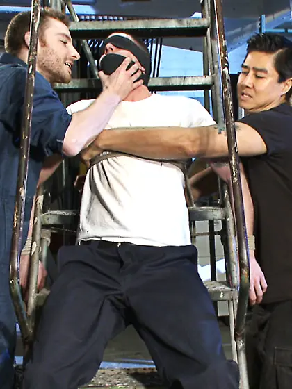 Tattooed guy strapped cock