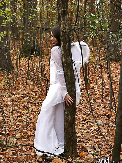 Cute and sexy babe,  Ariel Rebel posinfg in the woods in her sexy