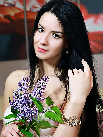 Corset-clad brunette showing her half-naked body in white stocki