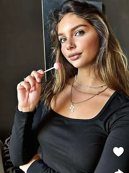Cute teen sucking a lollipop