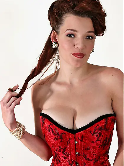 Sexy redhead momma Danielle Riley stripping corsette and posing