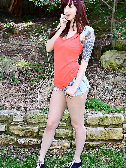 Naughty redhead babe Ivy Jean poses naked outdoors and makes our