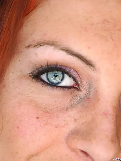 Cute redhead babe Jordan O'Neil gets off her jeans and show