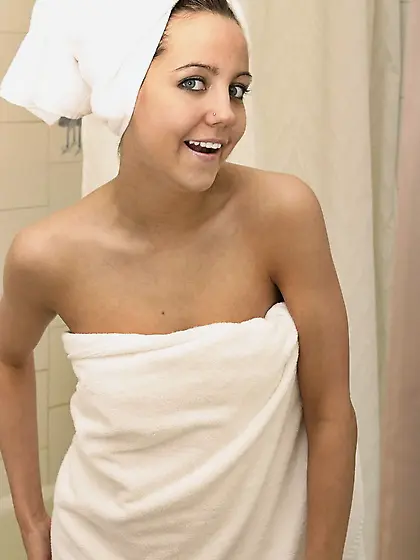 Cute teen angel Andi Pink takes off her white towel and shows he