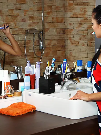 Hot brunette Gina Devine takes a shower and squeezes her pussy b