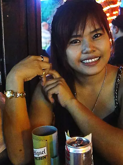 Pornographer buys pretty Thai girl a drink to make her pose with