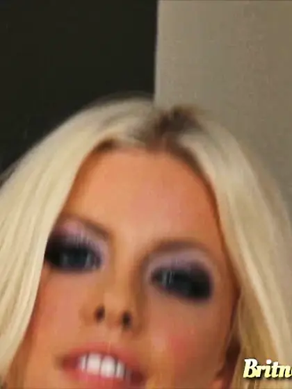 Bikini-clad blonde fingering herself on a...