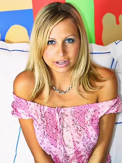 Blonde Natasha Dolling gets naked to show tan lines on her tits