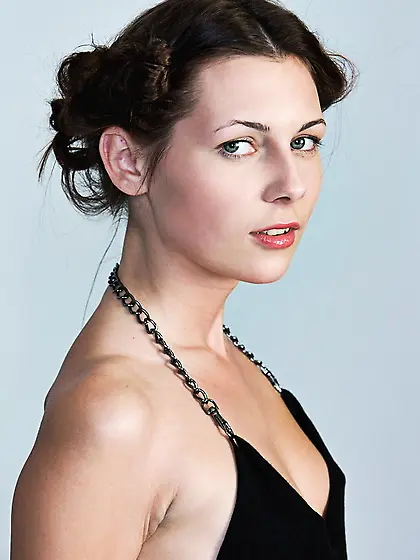 Lovely brunette strips her sexy black dress